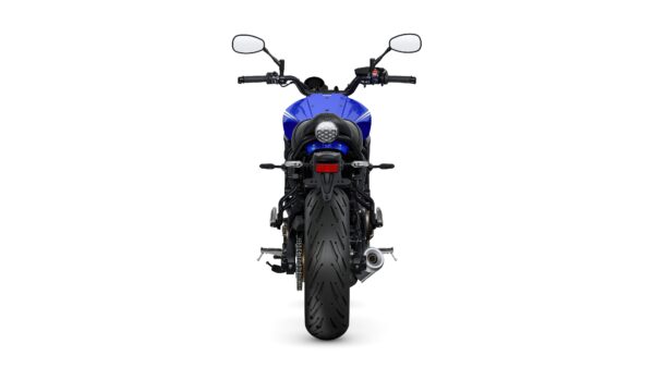 A rear view of a blue motorcycle featuring a large rear tire, a sleek tail light, and handlebars with mirrors. The background is white, highlighting the motorcycle's design.