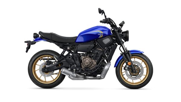 A side view of a blue Yamaha motorcycle with gold rims and a sleek design, showcasing its modern features and sporty appearance.