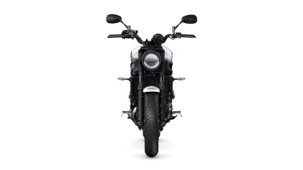 A front view of a black motorcycle with a round headlight, handlebars, and a wide tire, set against a white background.