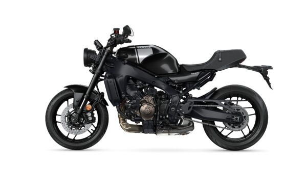A sleek black Yamaha XSR900 motorcycle shown from the side, featuring a minimalist design with a round headlight, sporty bodywork, and distinct engine detailing.