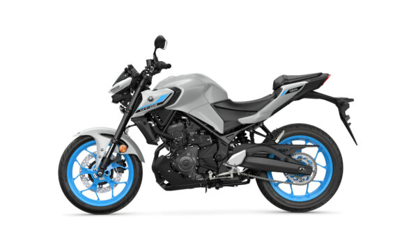 A gray Yamaha MT-03 motorcycle with blue accents is shown from the side, featuring a sleek design, stylish wheels, and a modern frame.