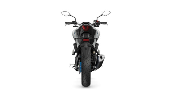 A rear view of a motorcycle showcasing its sleek design, prominent tail light, handlebars, and a large rear tire on a white background.