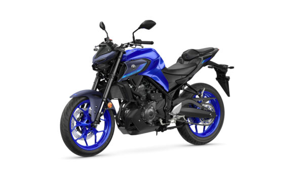 A blue Yamaha MT-03 motorcycle is displayed at an angle, showcasing its sleek design, prominent front headlight, sporty wheels, and a modern body line against a white background.