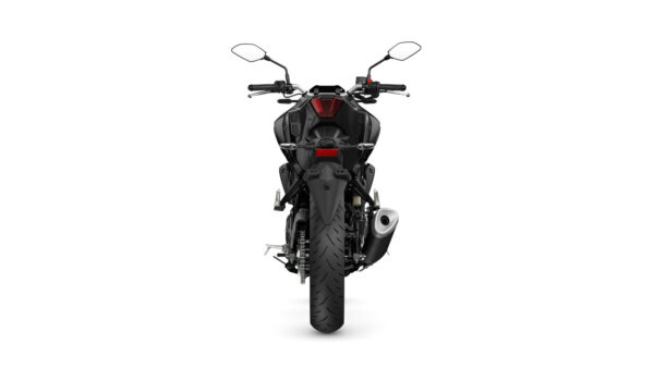 A rear view of a black motorcycle with a prominent tire, dual mirrors, and a sleek design, showcasing the tail light and exhaust.