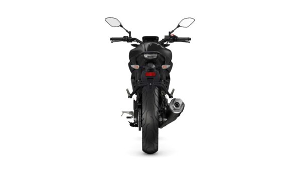 A sleek, matte black motorcycle viewed from the rear, showcasing its dual exhaust, taillights, and rear wheel.