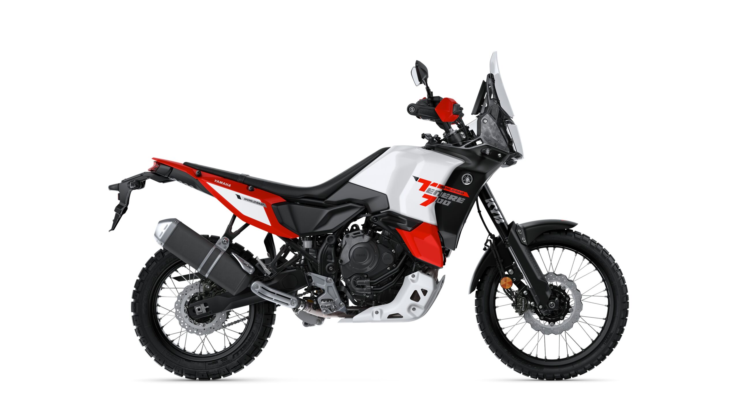 Yamaha 2026 Tenere 700 World Raid Redline Right A Yamaha Ténéré 700 motorcycle in a side profile view, featuring a combination of red, black, and white colors, rugged tires, and off-road styling.