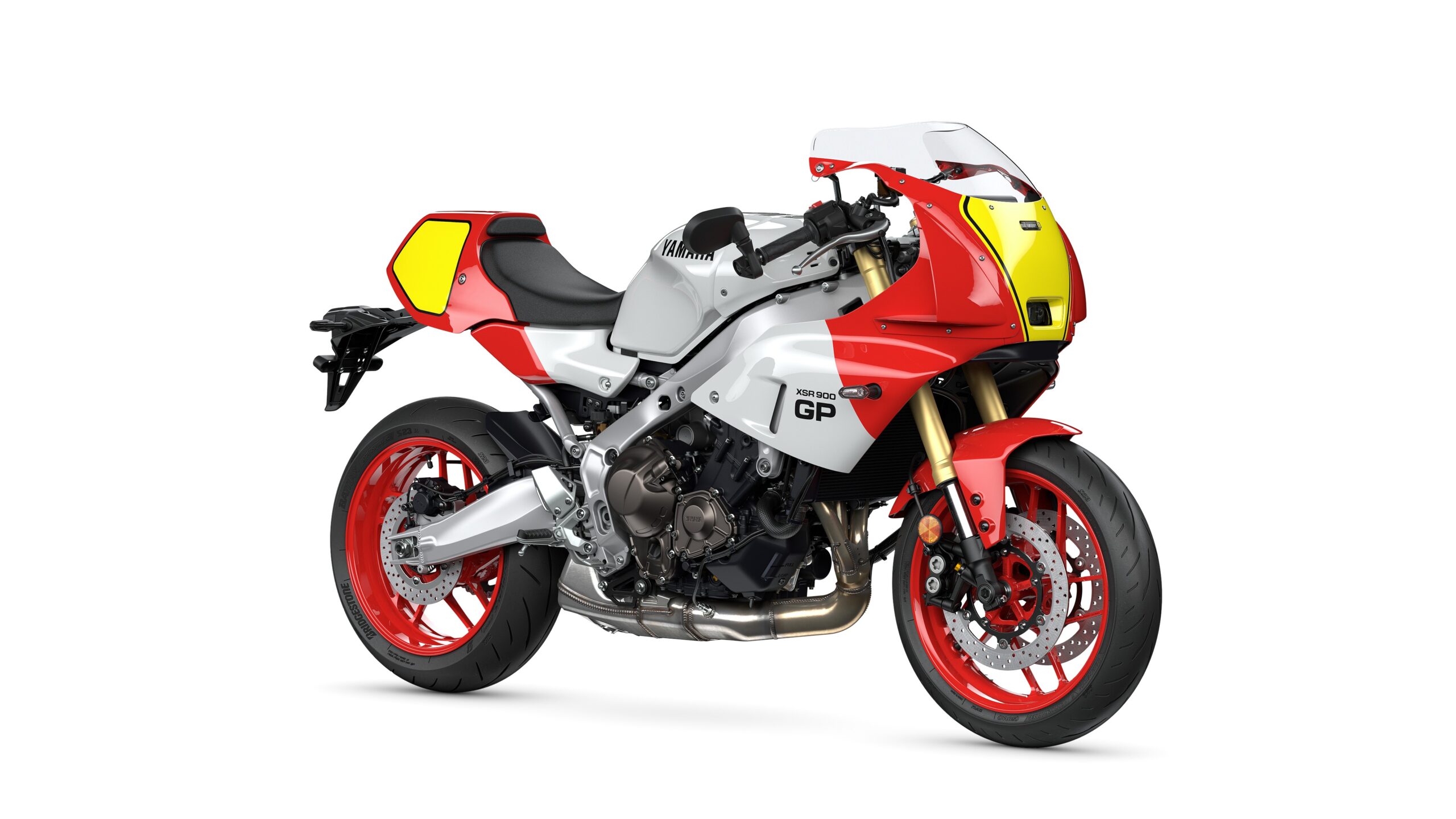 Yamaha 2026 XSR900 GP Legend Red - Lateral Right Yamaha XSR 900 GP motorcycle featuring a sleek design with a silver and red color scheme, sport-style fairings, and red wheels.