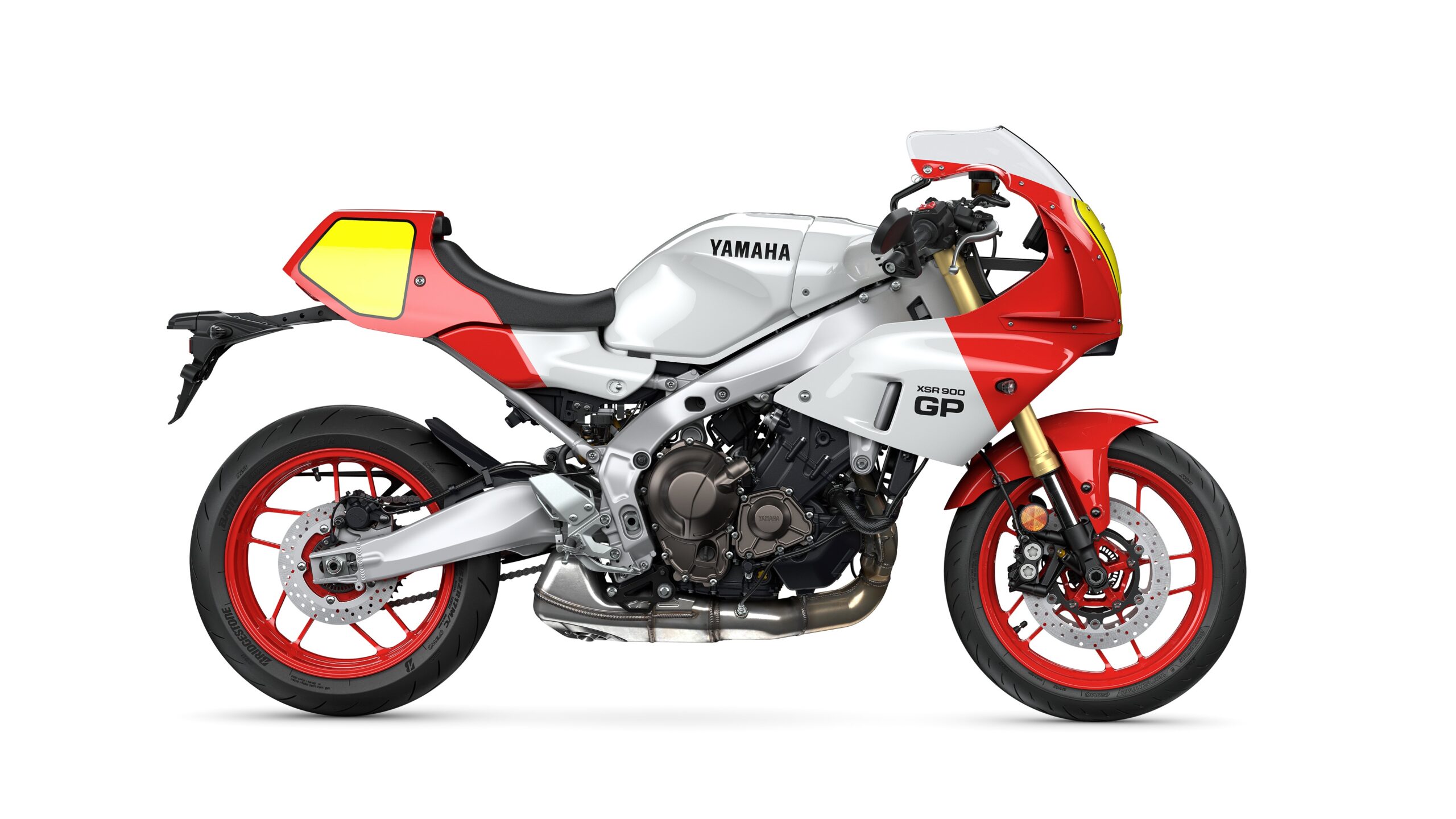 Yamaha 2026 XSR900 GP Legend Red - Right Side view of a Yamaha XSR900 GP motorcycle in a sleek silver and red color scheme, featuring distinctive fairings and modern styling.
