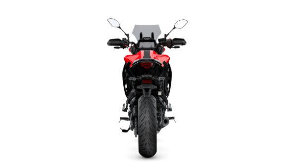 A red motorcycle viewed from the rear, showcasing its large rear tire, sleek design, and handlebars with mirrors. The background is plain white, emphasizing the motorcycle's features.