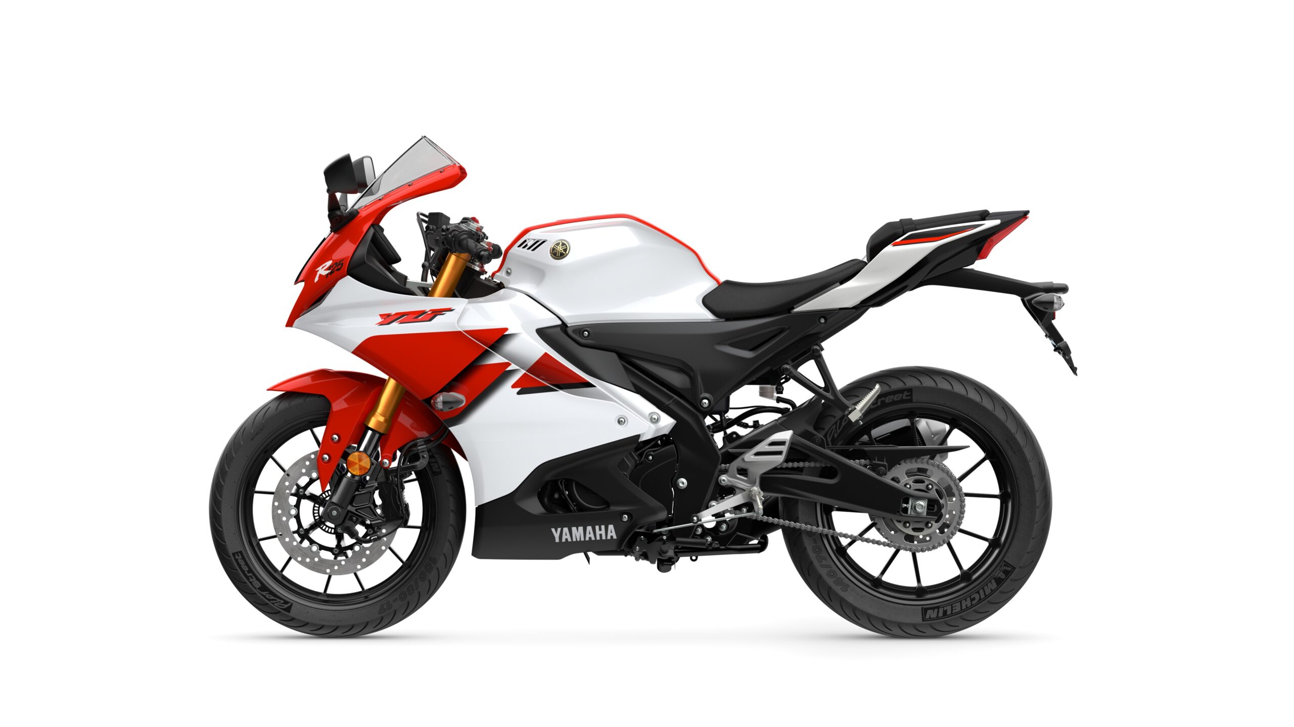 2026 Yamaha R125 Anniversary White Left A side view of a Yamaha YZF-R25 motorcycle in white and red color scheme, showcasing its sporty design and features, including the windshield, sleek bodywork, and modern tires.