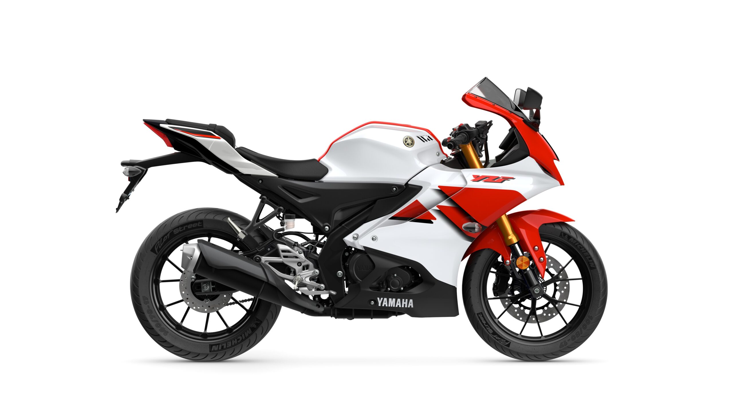 2026 Yamaha R125 Anniversary White Right A sleek, modern Yamaha sports motorcycle in white and red, showcasing a streamlined design and sporty aesthetics, viewed from the side.