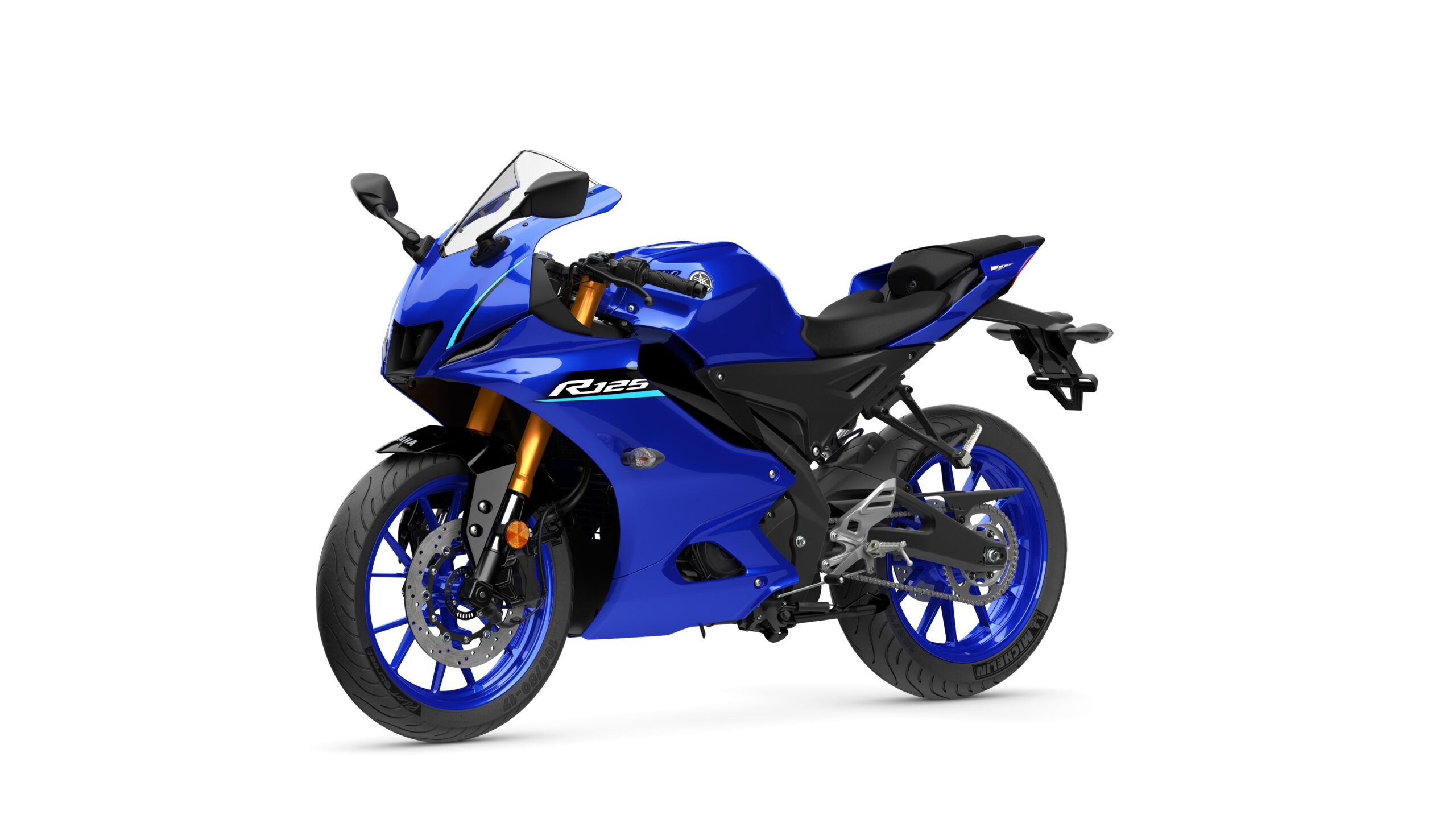 2026 Yamaha R125 Icon Blue Lateral Left A blue sport motorcycle with a sleek design, featuring a fairing, a windscreen, and distinctive blue wheels. The model designation "R125" is displayed on the side.