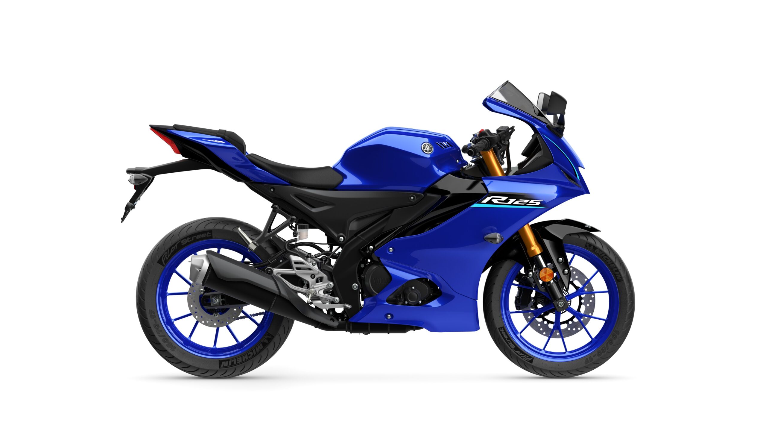 2026 Yamaha R125 Icon Blue Right A blue Yamaha R125 motorcycle displayed from the side, featuring a sleek design, sporty fairings, and distinctive blue rims.