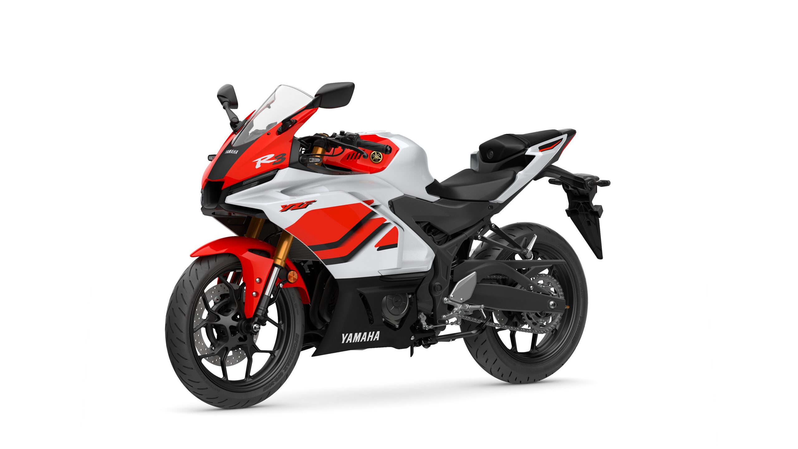 2026 Yamaha R3 Anniversary Edition Lateral Left A Yamaha YZF-R3 motorcycle in white and red with sleek bodywork, a racing windscreen, and a sporty design, displaying its side profile against a white background.