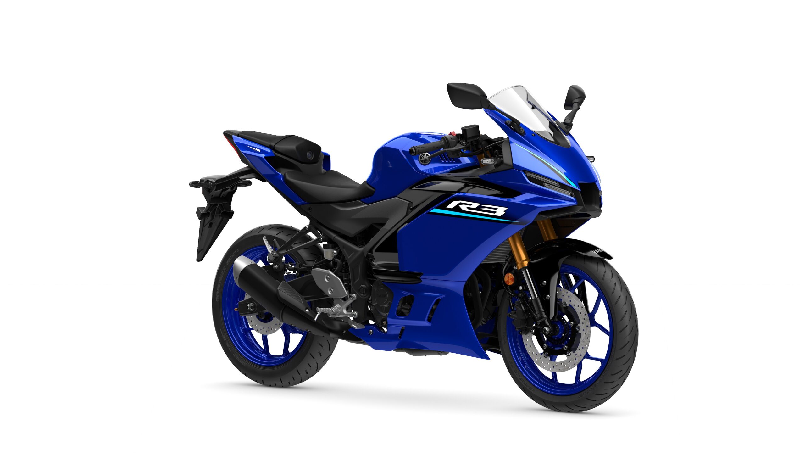 2026 Yamaha R3 Icon Blue Lateral Right Yamaha 2026 R3 A blue Yamaha R3 motorcycle positioned at an angle, showcasing its sleek design, sporty style, and modern features.