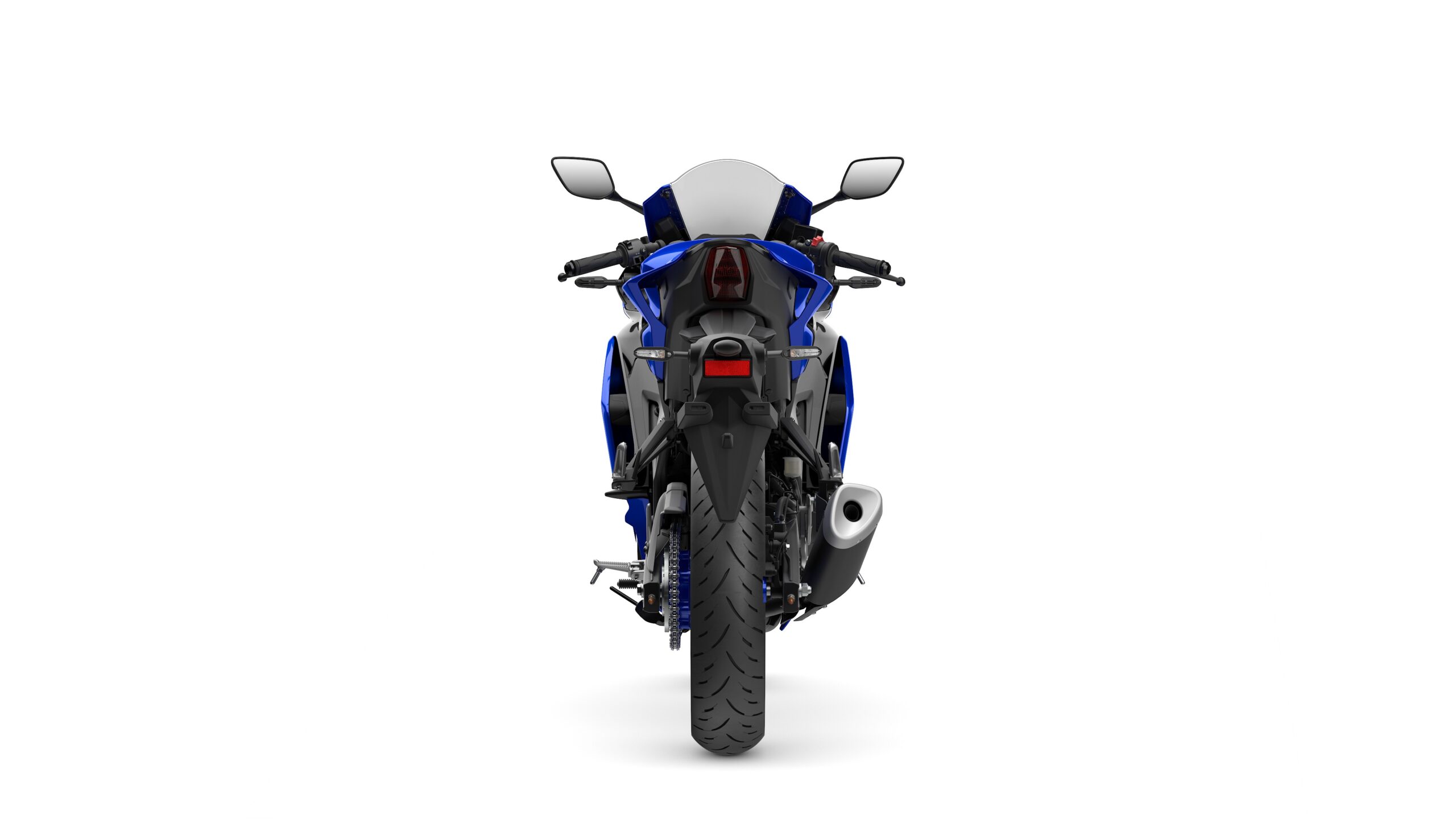 2026 Yamaha R3 Icon Blue Rear A blue and black sport motorcycle is displayed from the rear, showcasing its sleek design, prominent rear wheel, and exhaust pipe. The background is plain white, emphasizing the bike's features.