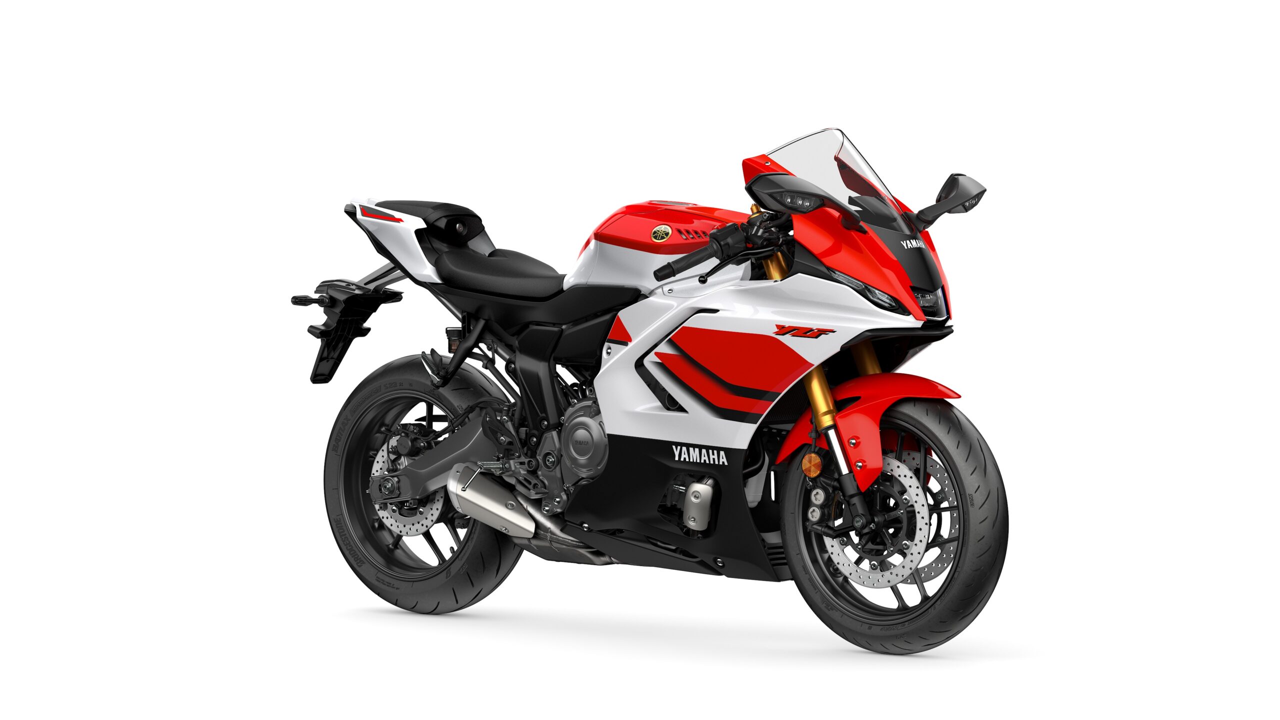 2026 Yamaha R7 Anniversary Edition Lateral Right Yamaha 2026 R7 A sleek red, white, and black Yamaha YZF motorcycle is displayed, featuring a sporty design, aerodynamic fairings, and prominent branding on the side.
