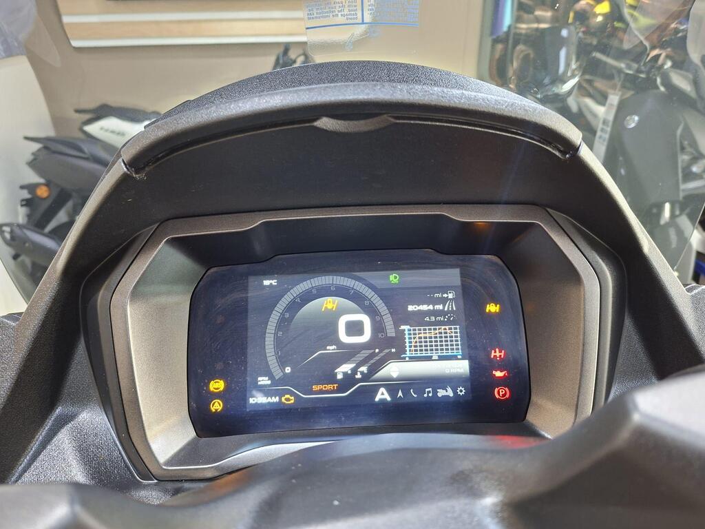 Piaggio MP3 400 LC72 KHB 9 Dashboard display of a motorcycle, featuring a digital speedometer showing 0 mph, odometer reading 20,454 miles, temperature in °C, and various indicator lights including sport mode and warnings.
