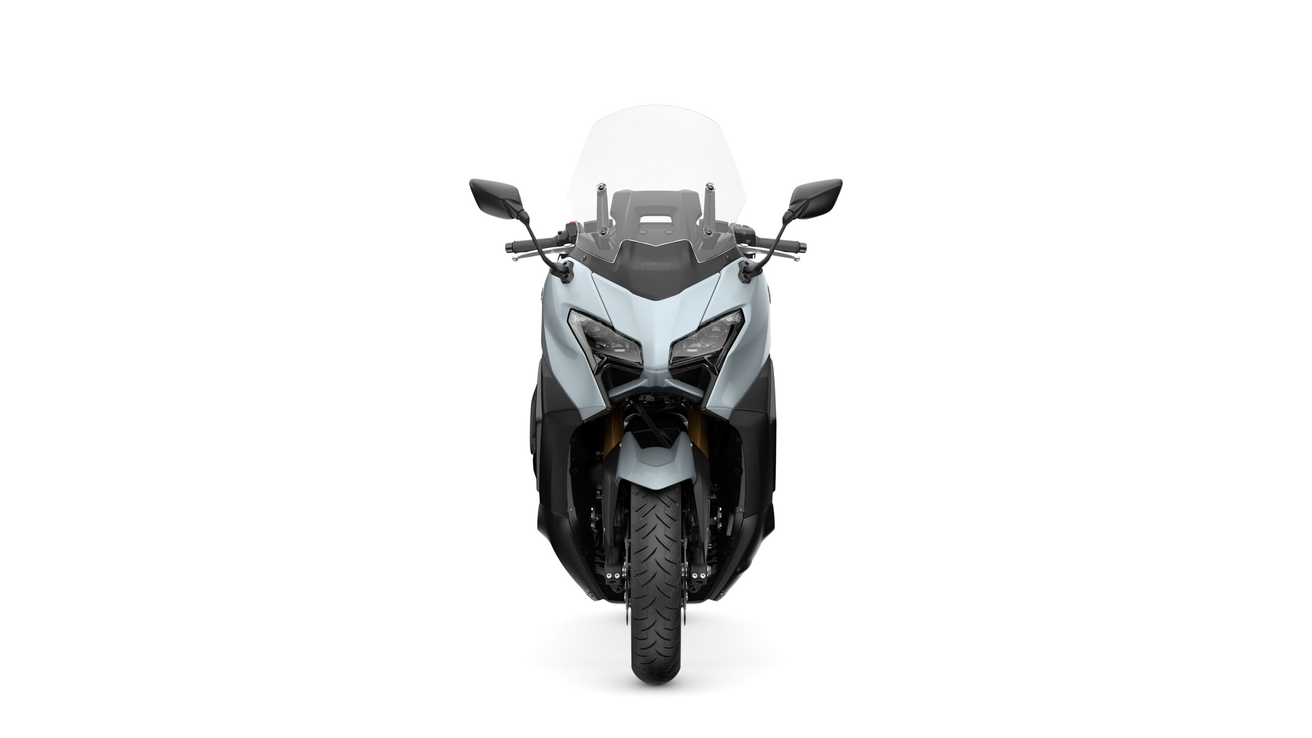 2026 Yamaha TMAX TECH MAX Ceramic Grey Front Front view of a sleek, modern motorcycle with a transparent windshield, dual headlights, and an angular design, set against a plain white background.