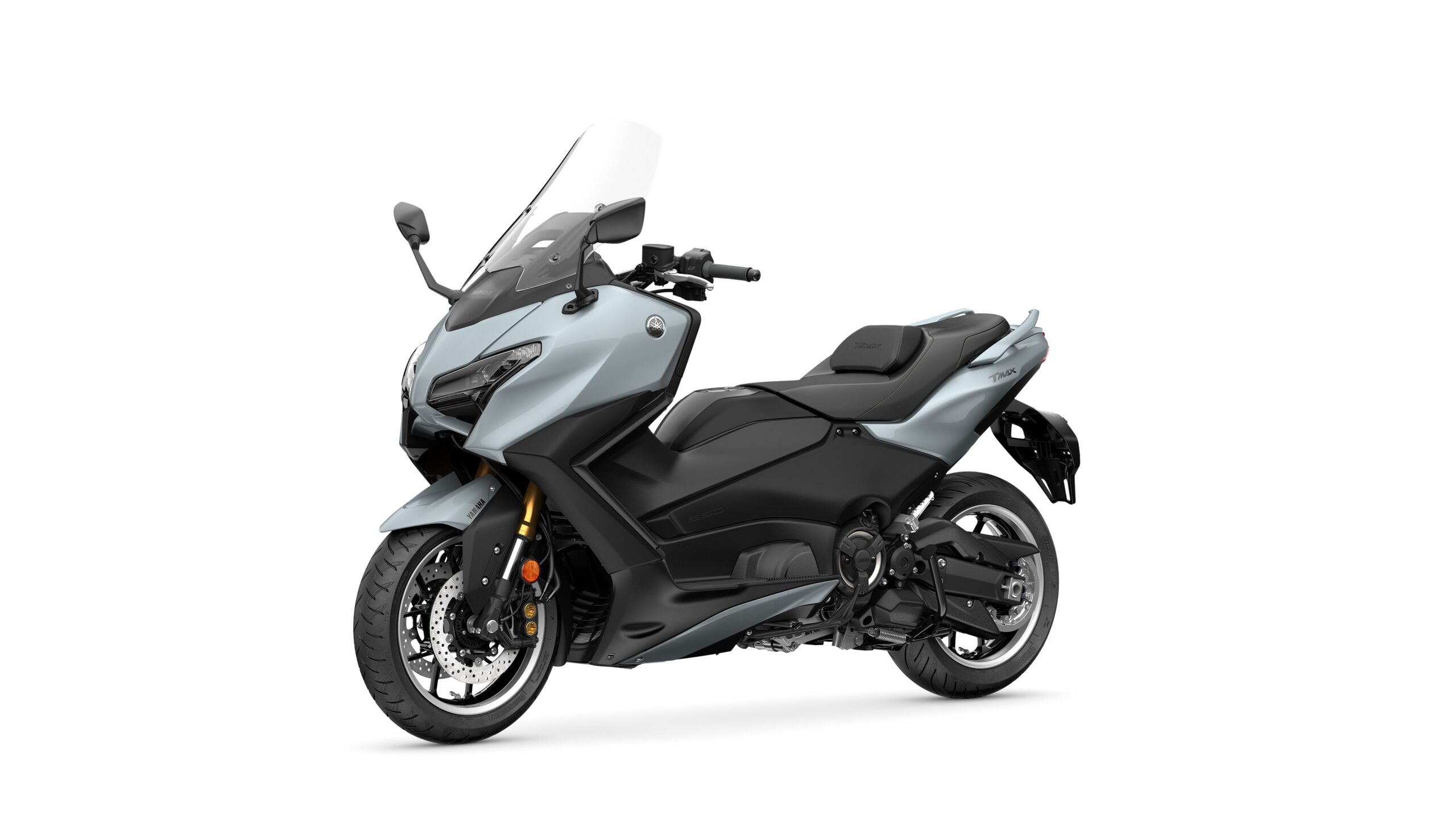 2026 Yamaha TMAX TECH MAX Ceramic Grey Lateral Left A sleek, modern motorcycle in a light blue and black color scheme, featuring a tall windshield, sporty design, and prominent Yamaha branding.