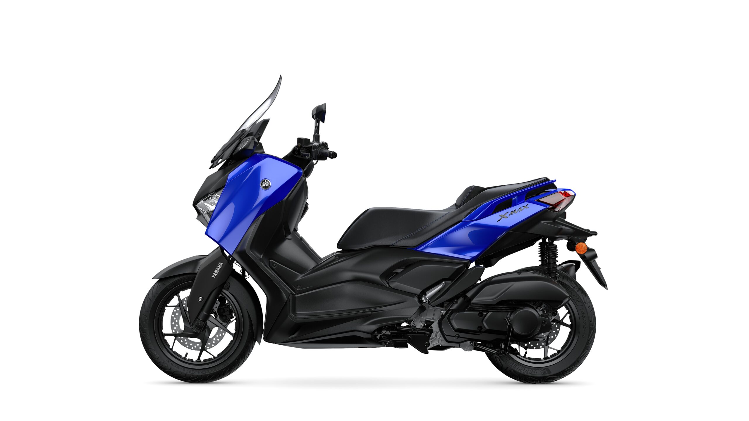 Yamaha 2026 XMAX 125 Icon Blue Left A blue Yamaha XMAX scooter shown from the side, featuring a sleek design, with a black seat and accents, and a transparent windscreen.