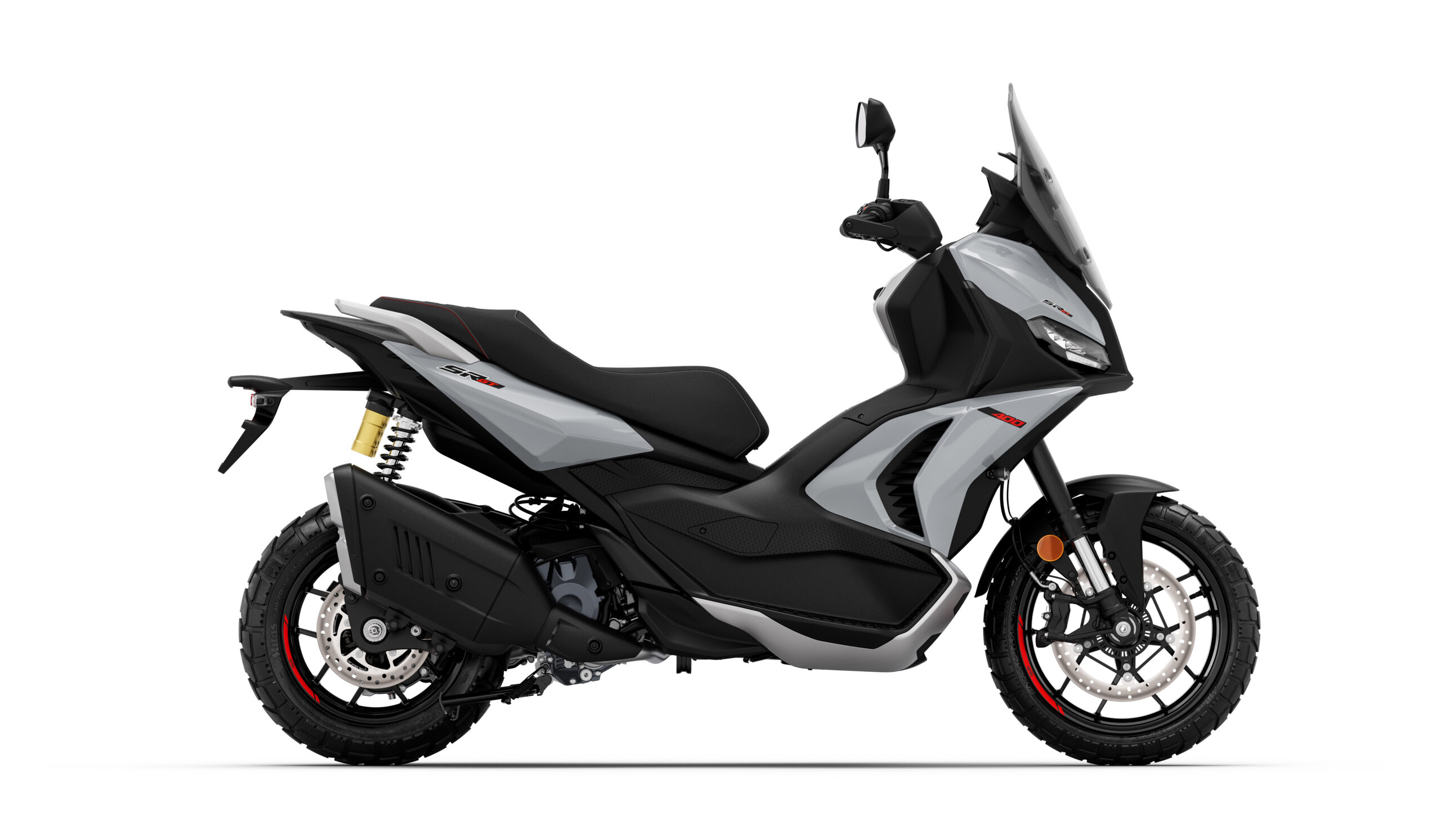 Aprilia_SR-GT-400_Dusty-Grey_Lat-dx Side view of a modern gray and black scooter with a sleek design, featuring off-road tires, dual suspension, and a protective windshield.