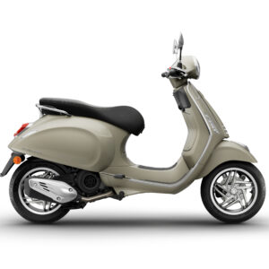 Vespa Primavera 125 Euro 5 + 2026 A stylish beige scooter with a sleek design and chrome accents, positioned against a white background.