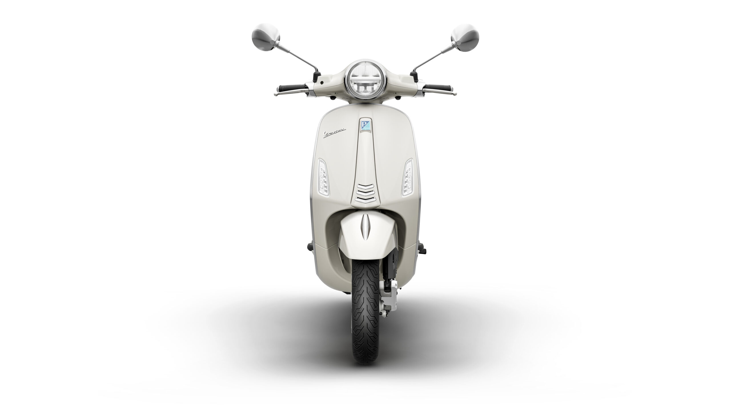 Primavera 125 2026 Bianco Innocente Front Front view of a cream-colored scooter with a round headlight and two rearview mirrors, set against a white background.