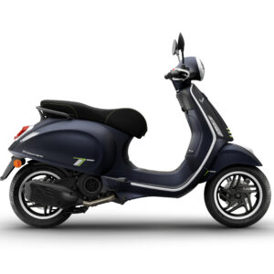 Vespa Primavera 125 Tech Euro 5 + 2026 A sleek navy blue scooter with a black seat and green accents, viewed from the side against a white background.