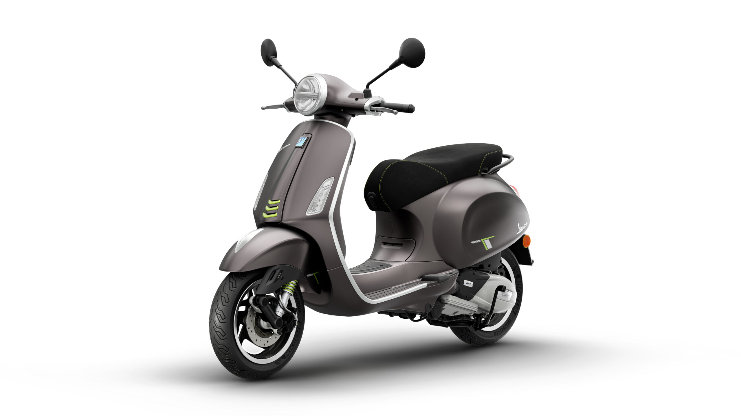 Primavera Tech 125 2026 Grigio Ottimista Lateral Left A sleek, modern scooter in a muted gray color with green accents, featuring a comfortable seat and classic design elements, positioned against a white background.