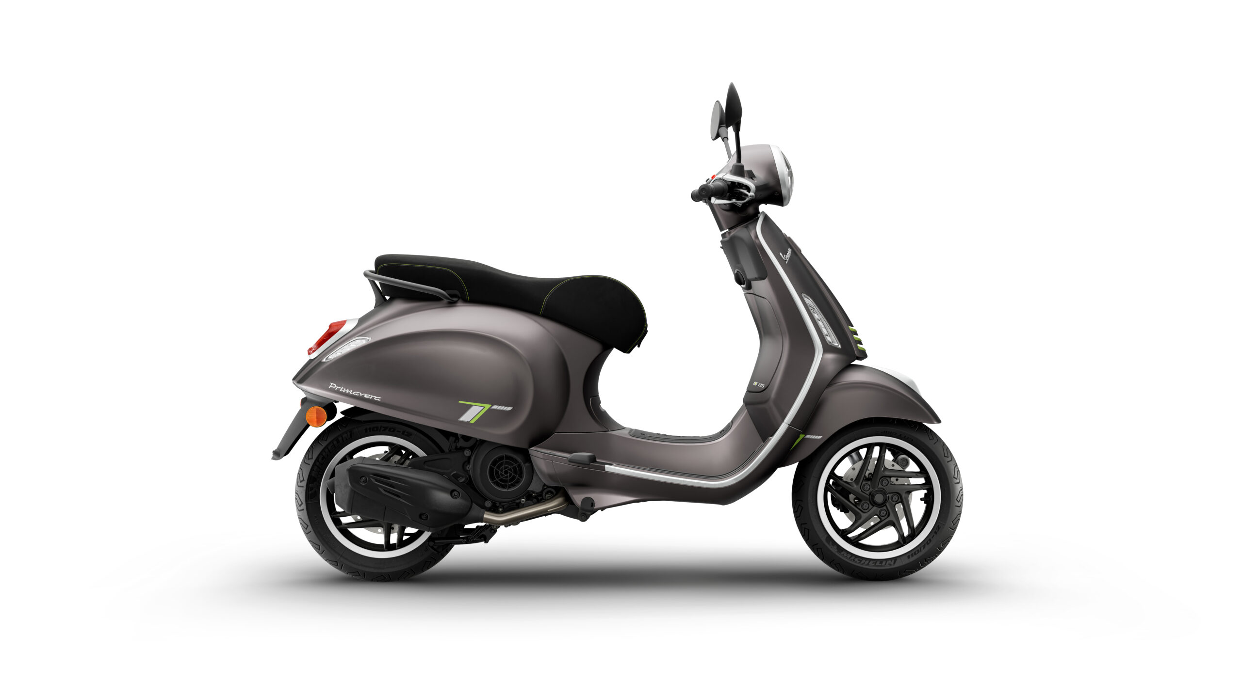 Primavera Tech 125 2026 Grigio Ottimista Right A modern gray scooter with a black seat, featuring green accents and a sleek design, is displayed against a white background.