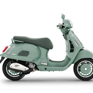 A mint green vintage-style scooter is shown in profile, displaying its sleek design, round headlight, and comfortable seat. The scooter features chrome accents and distinctively patterned wheels.