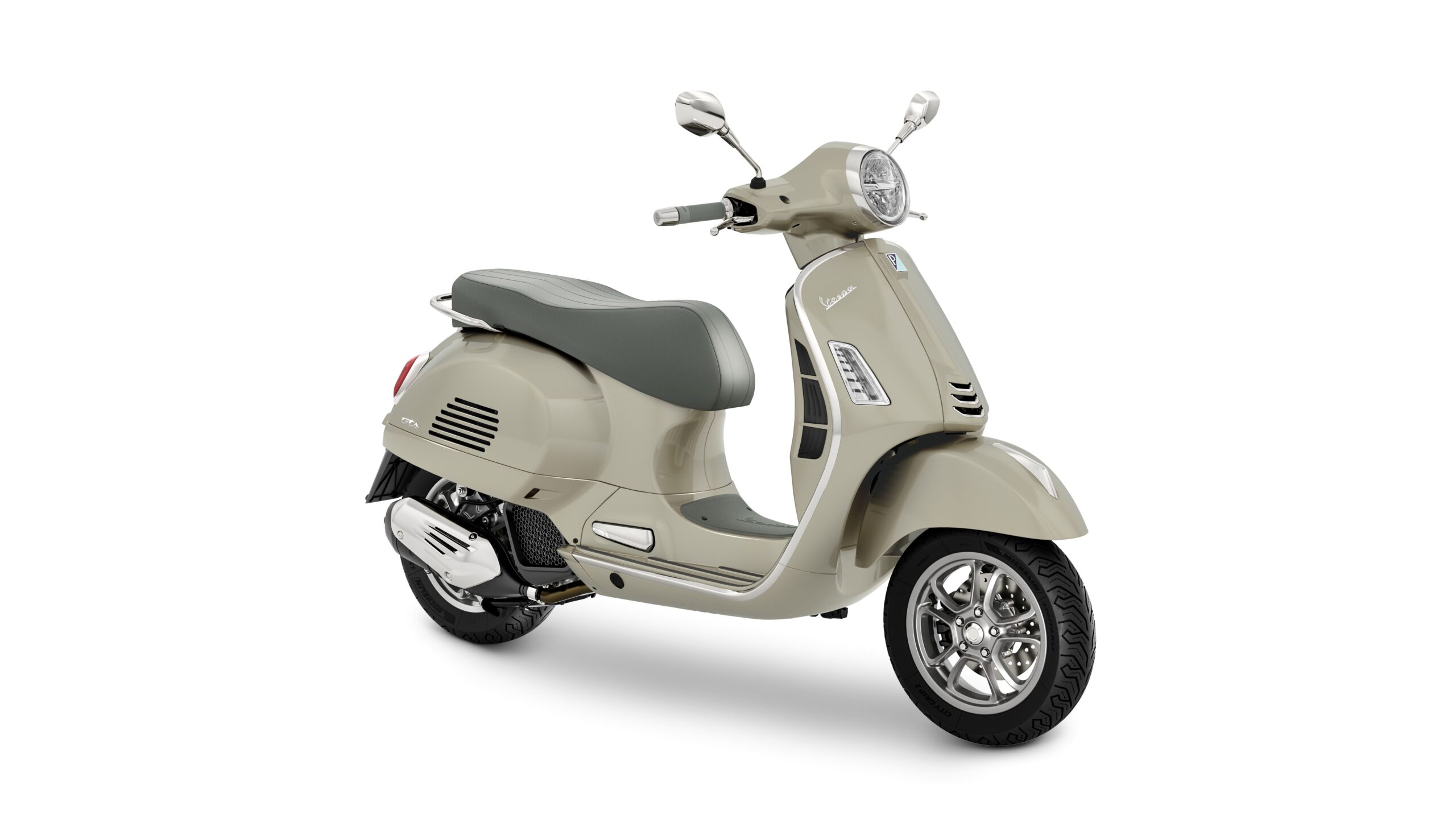 Vespa GTS 125 2026 Beige Avvolgente Lateral Right A beige Vespa scooter with a grey seat, showcasing a sleek design and chrome accents, parked on a white background.