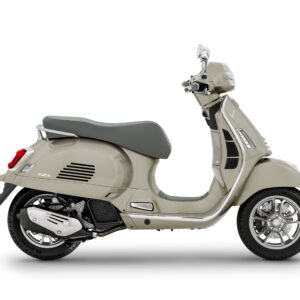 A beige scooter with a grey seat, positioned at a slight angle, featuring chrome accents and five-spoke wheels.