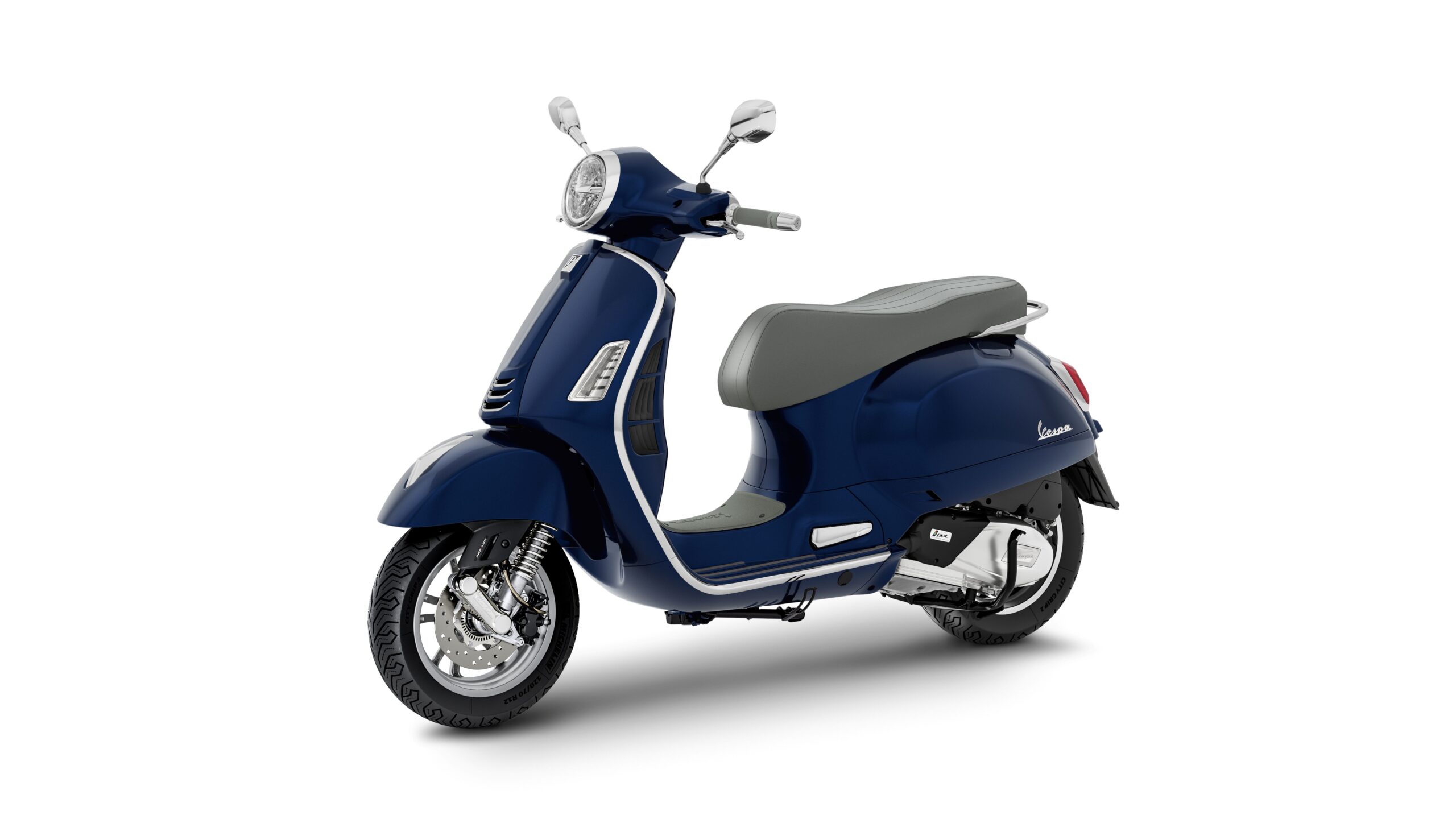 Vespa GTS 125 2026 Blu Energico Lateral Left A dark blue scooter with a grey seat, featuring a chrome finish on the front and back, stands on a white background.