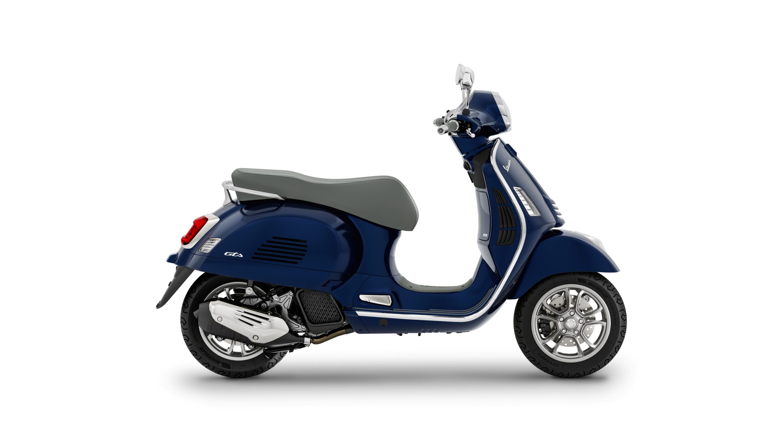 Vespa GTS 125 2026 Blu Energico Right A side view of a navy blue scooter with a grey seat and chrome accents, featuring a rounded design and a stylish rear light.