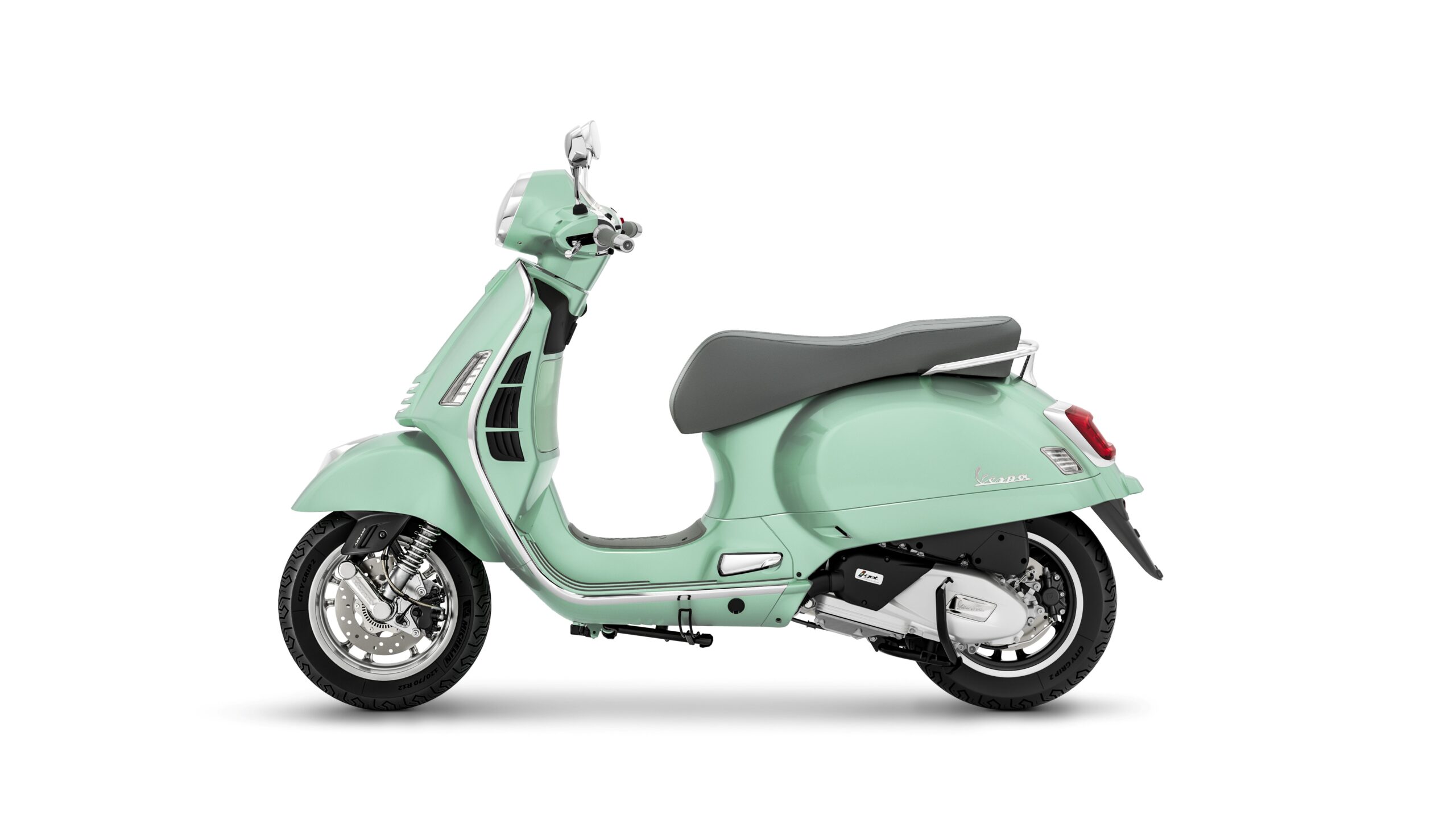Vespa GTS 125 2026 Verde Amabile Left A mint green Vespa scooter shown from the side, featuring a modern design with silver accents and a gray seat against a white background.