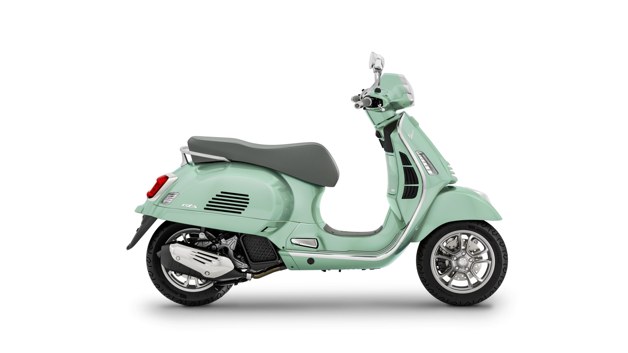 Vespa GTS 125 2026 Verde Amabile Right A light green Vespa scooter viewed from the side, featuring a gray seat, chrome accents, and a single headlight.