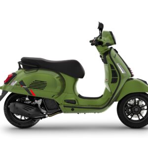A green Vespa scooter positioned side-on with a modern design, featuring a black seat and stylish wheel spokes, set against a white background.