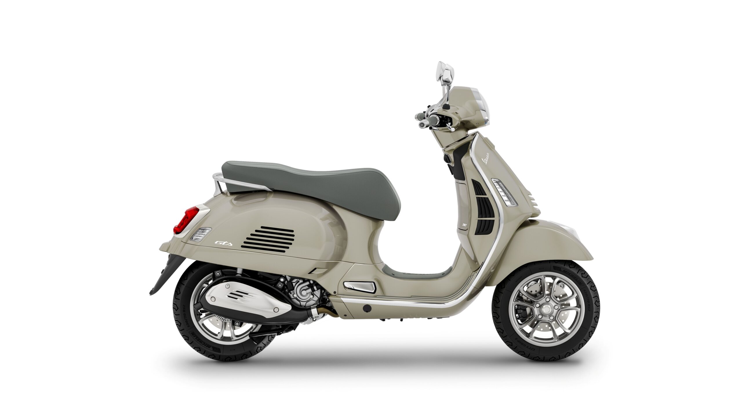 Vespa GTS 310 2026 Beige Avvolgente Right A side view of a light beige Vespa scooter with a grey seat and chrome details, showcasing its classic design and modern features.