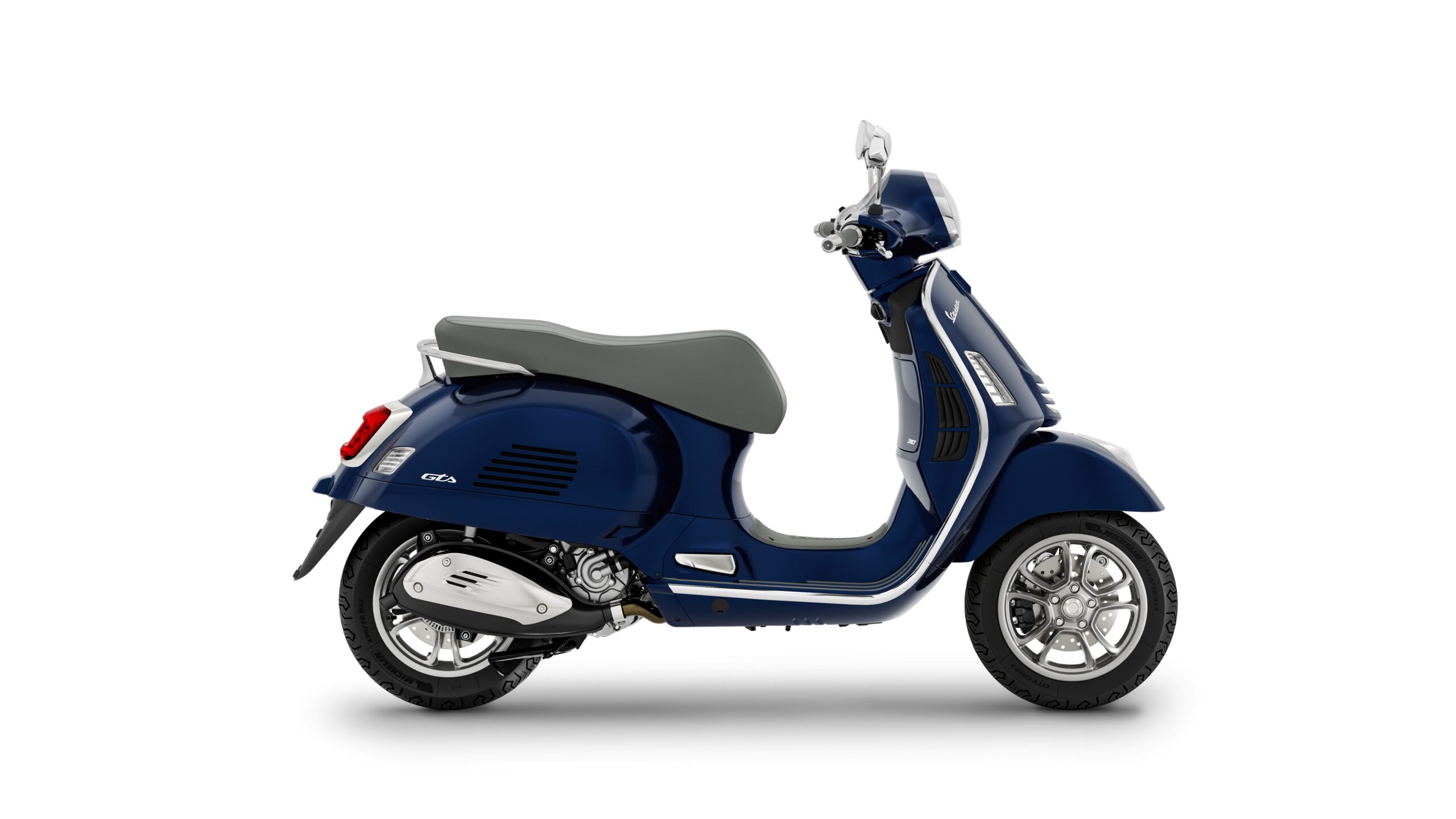 Vespa GTS 310 2026 Blu Energico Right A blue Vespa scooter with a grey seat, viewed from the side against a white background.
