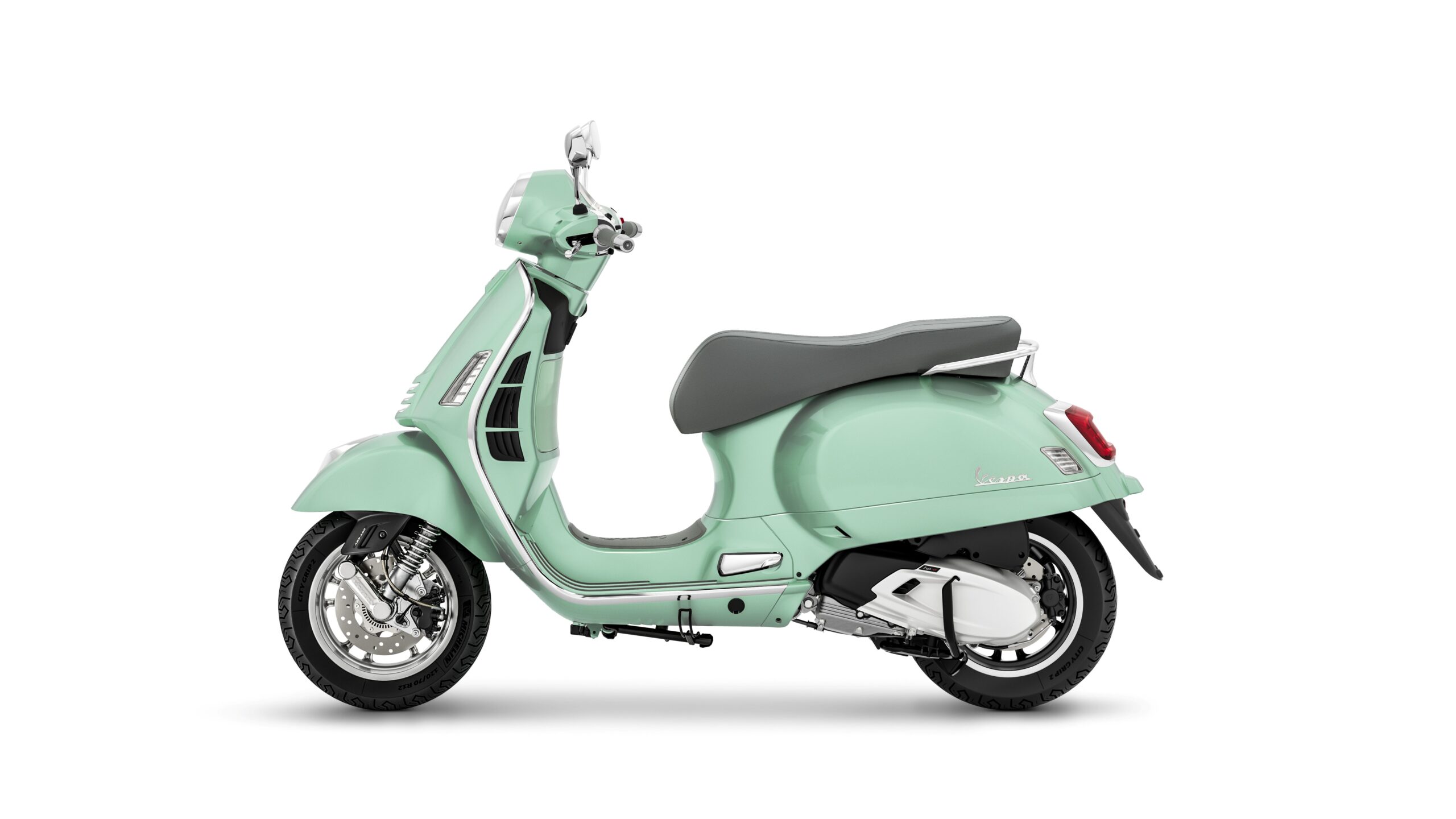 Vespa GTS 310 2026 Verde Amabile Left A vintage-style mint green scooter with a sleek design, featuring a grey seat, chrome accents, and a distinctive rounded shape. The scooter is displayed from the side against a plain white background.