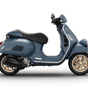 A stylish blue Vespa scooter with gold rims and a black seat, viewed from the side.